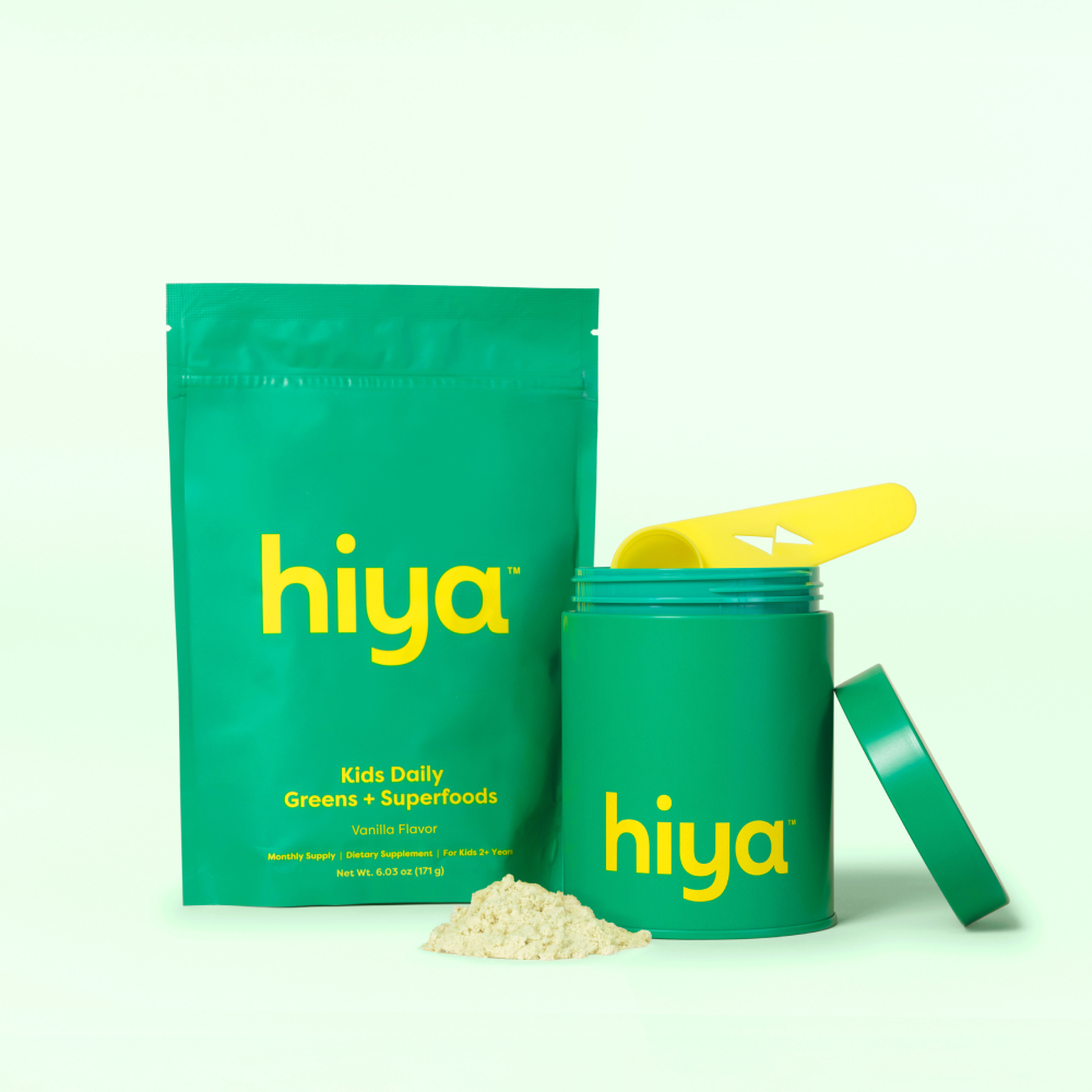 Hiya Kids Daily Greens + Superfoods Vanilla canister, refill pouch, scoop, and sticker pack